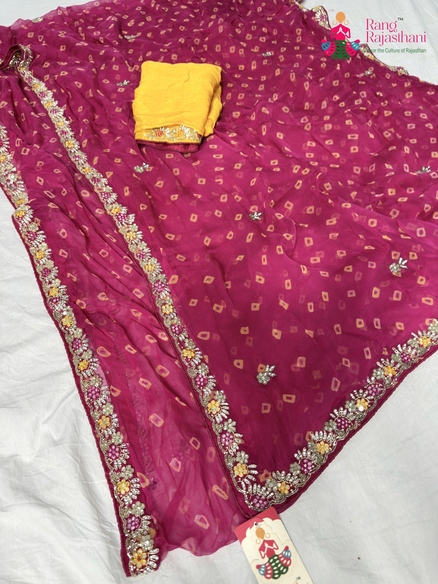 close up detailing of rani chiffon hand embellishment saree