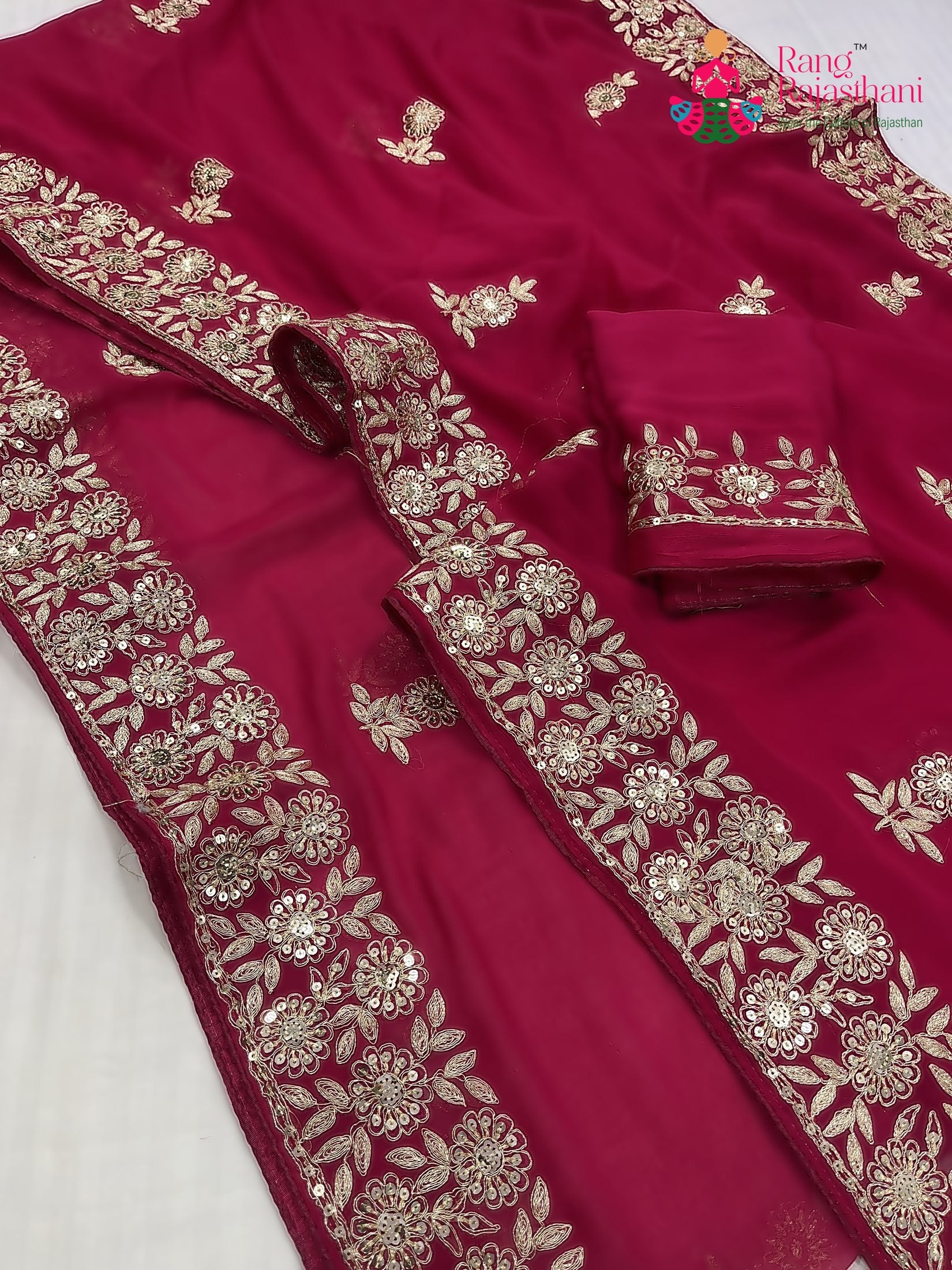 close up detailing of rani chiffon zari embroidery saree