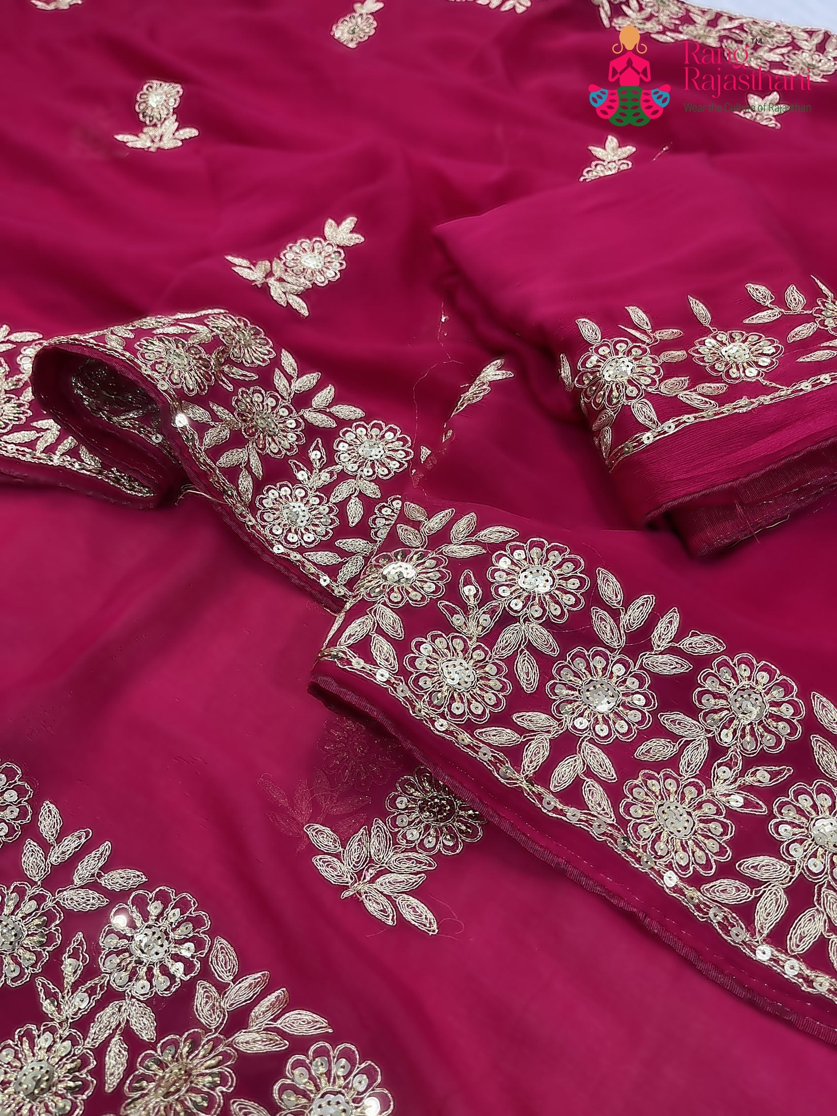 border detailing of rani chiffon zari embroidery saree