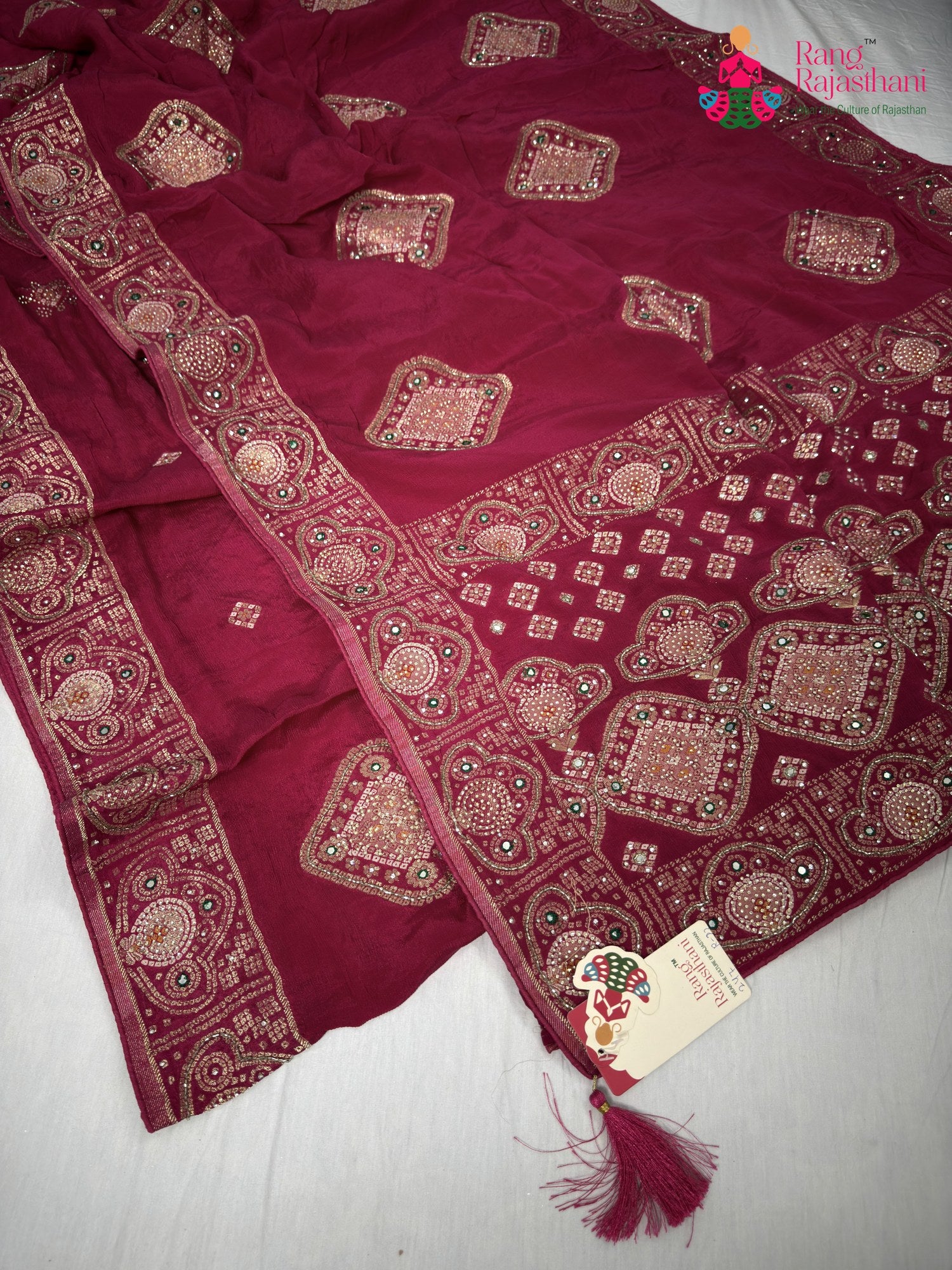 close up detailing of rani chinnon hand embellishment saree
