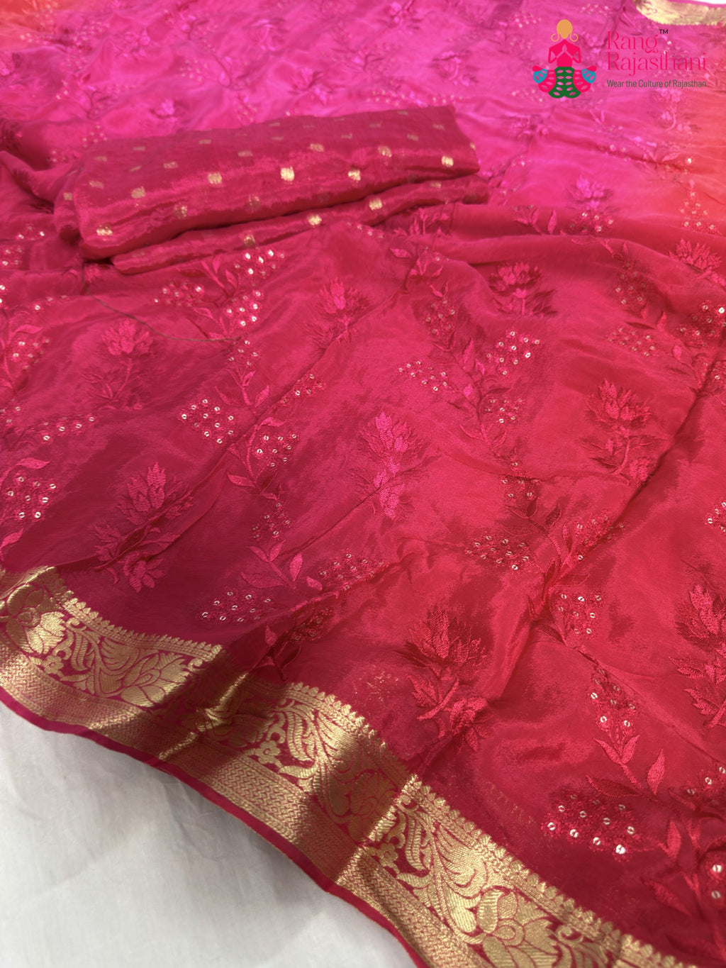 close up detailing of rani chinnon resham embroidery saree