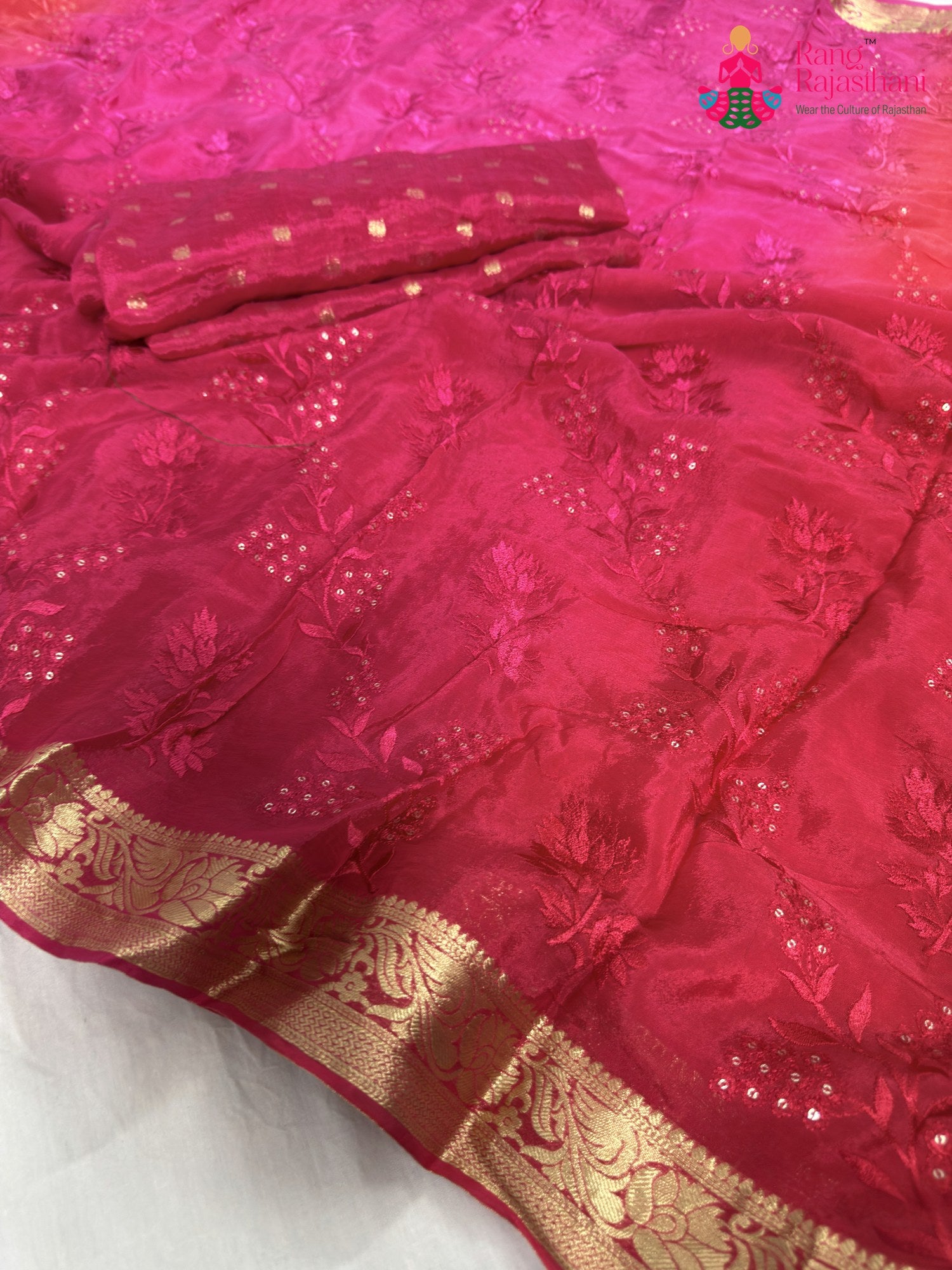 close up detailing of rani chinnon resham embroidery saree