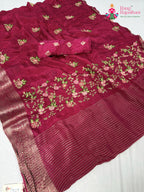 close up detailing of rani chinnon resham embroidery saree