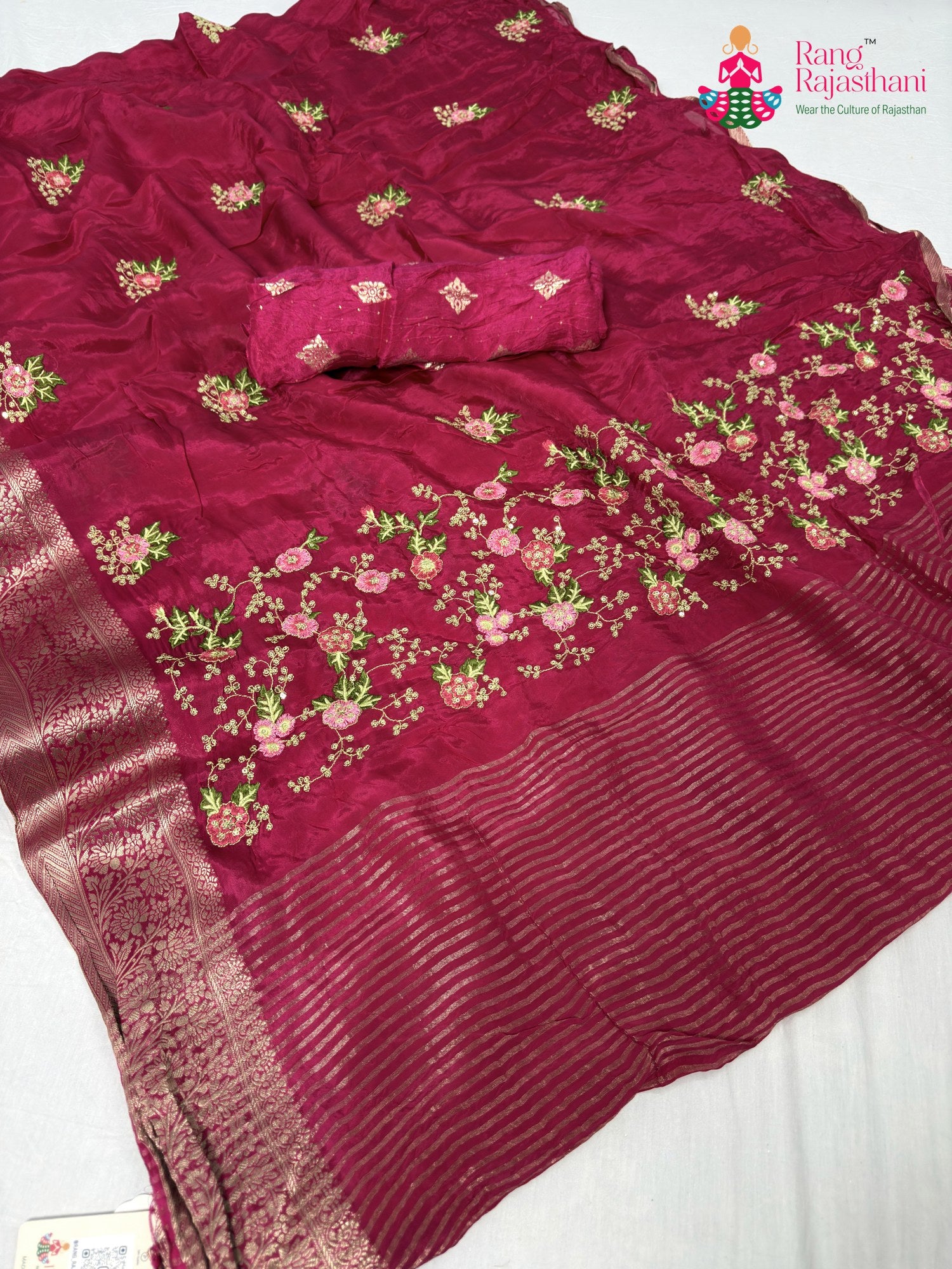 close up detailing of rani chinnon resham embroidery saree