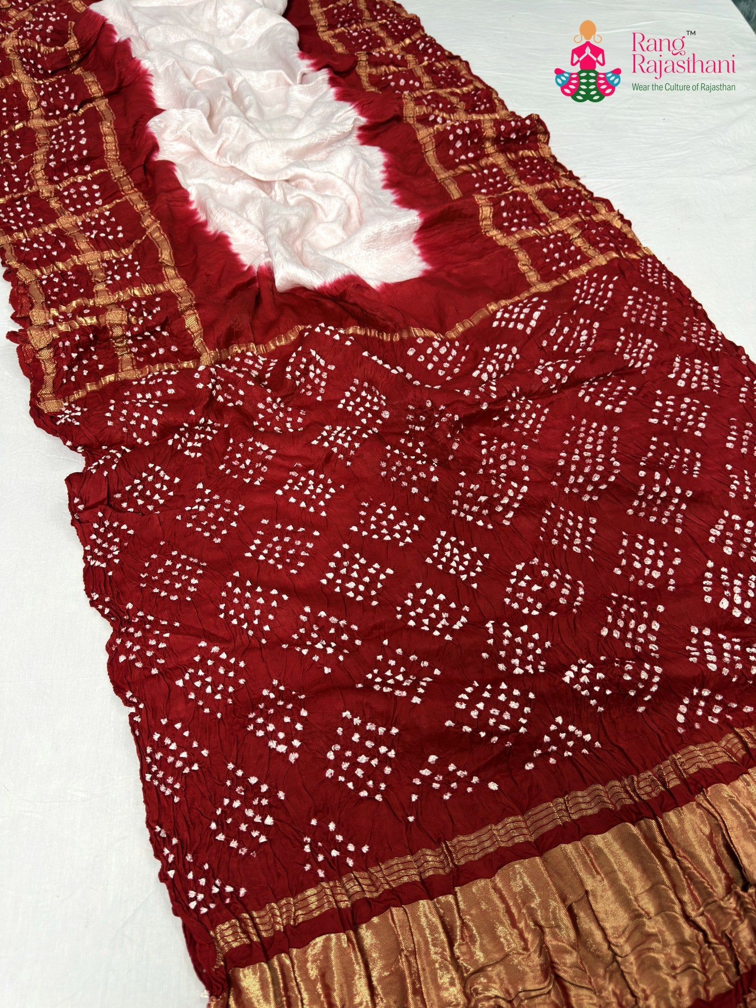 close up detailing of rani gajji silk bandhani saree
