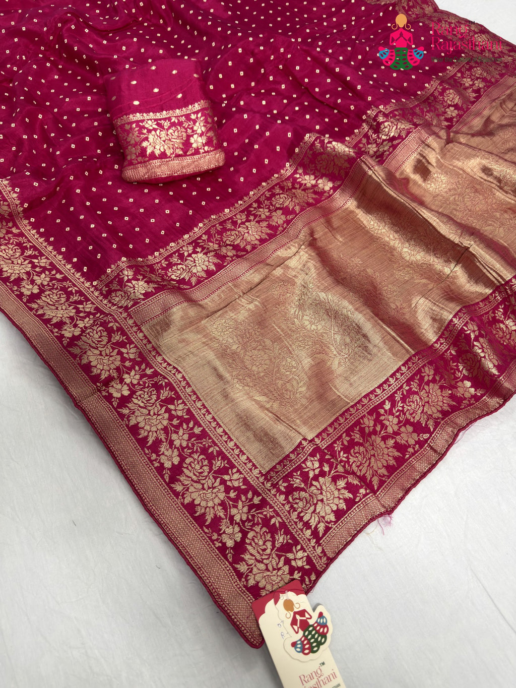 close up detailing of rani pure khaddi georgette bandhani saree