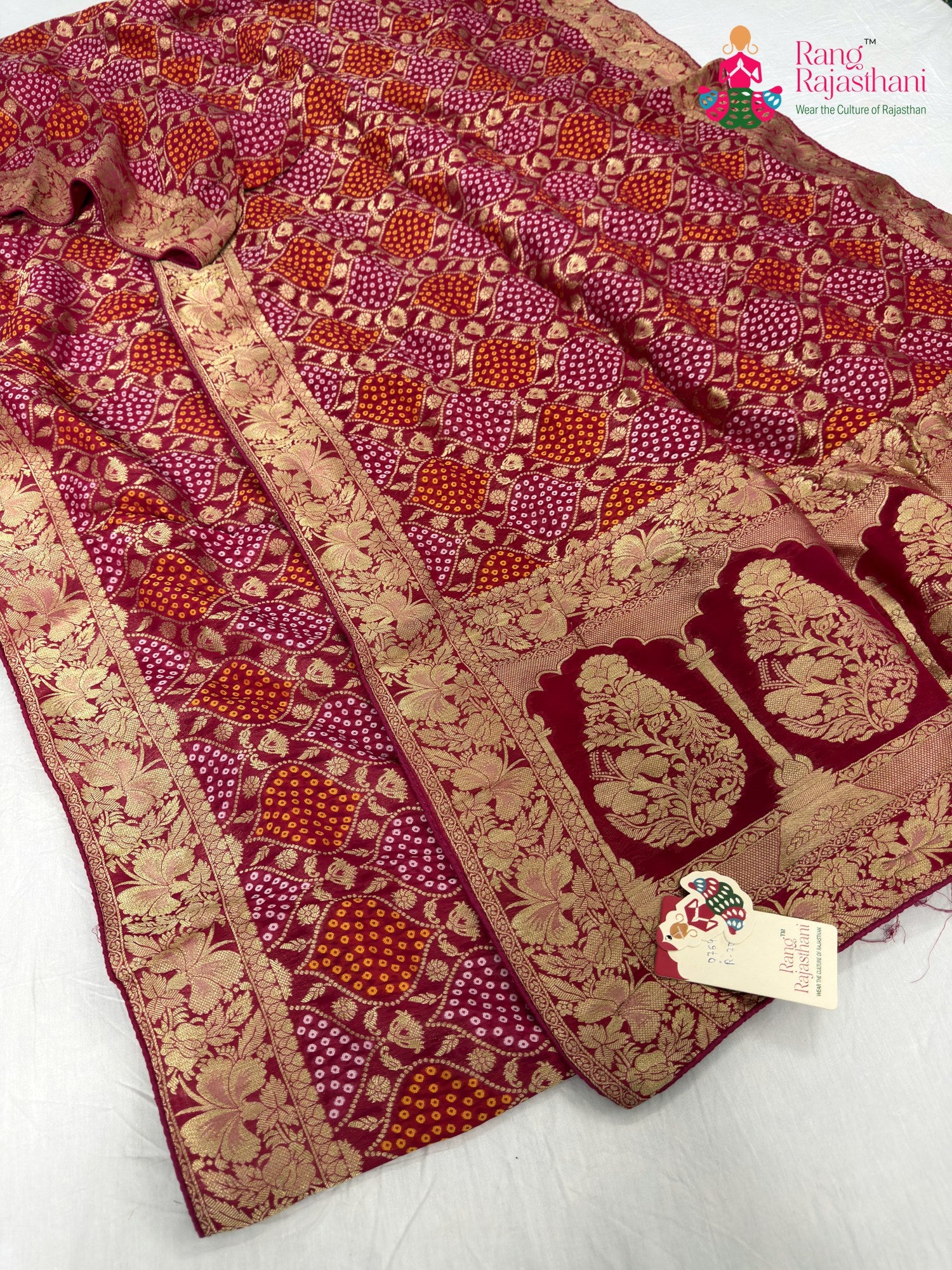 close up detailing of rani pure khaddi georgette bandhani saree