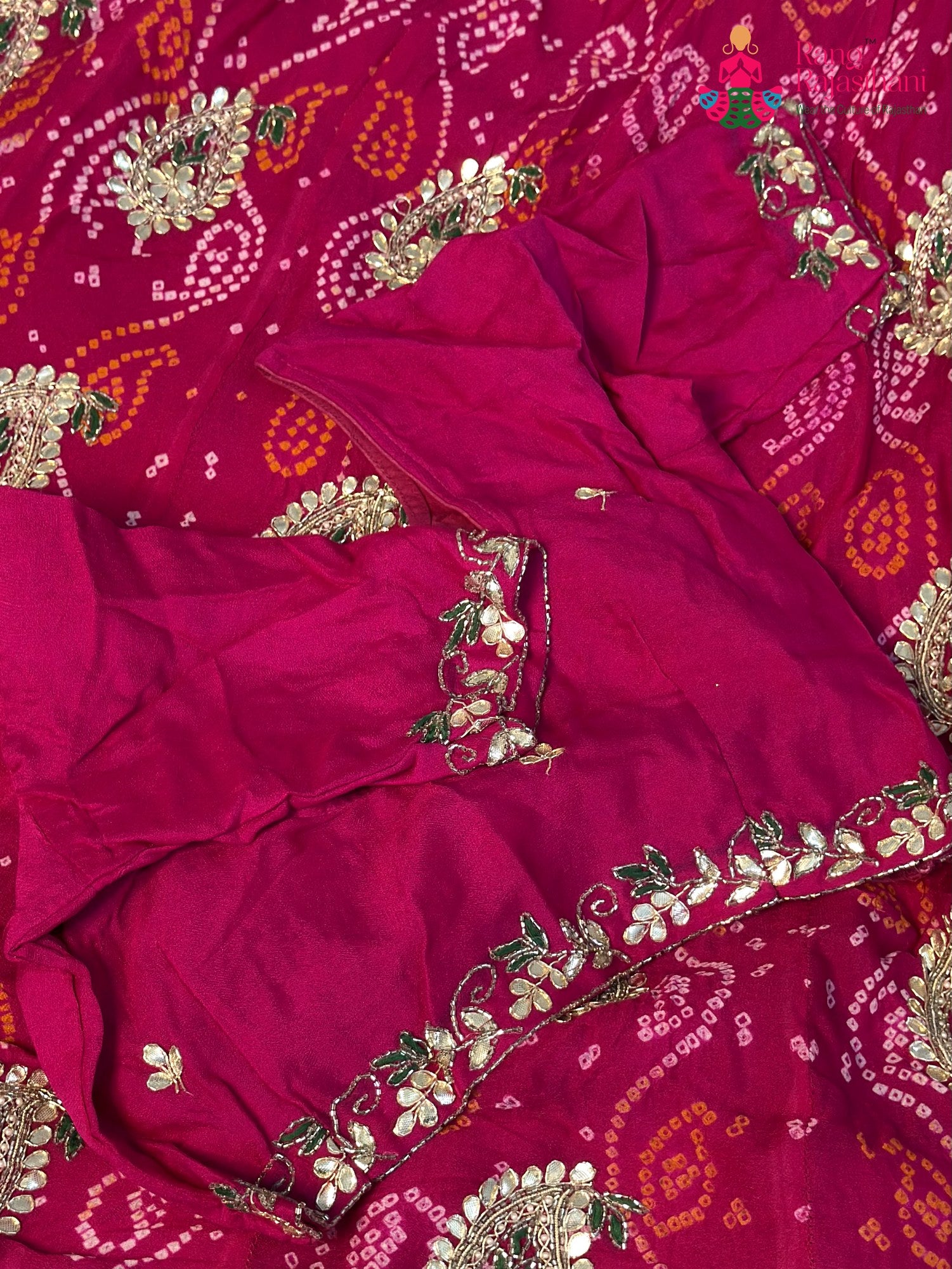 close up view of rani pure ojariya bandhani lehenga chunni