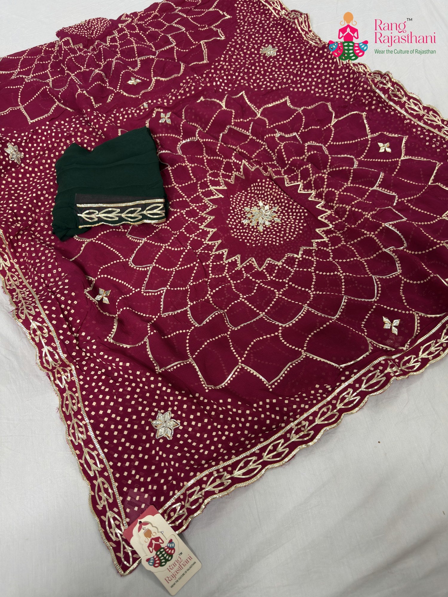 close up detailing of rani soft georgette bandhani saree