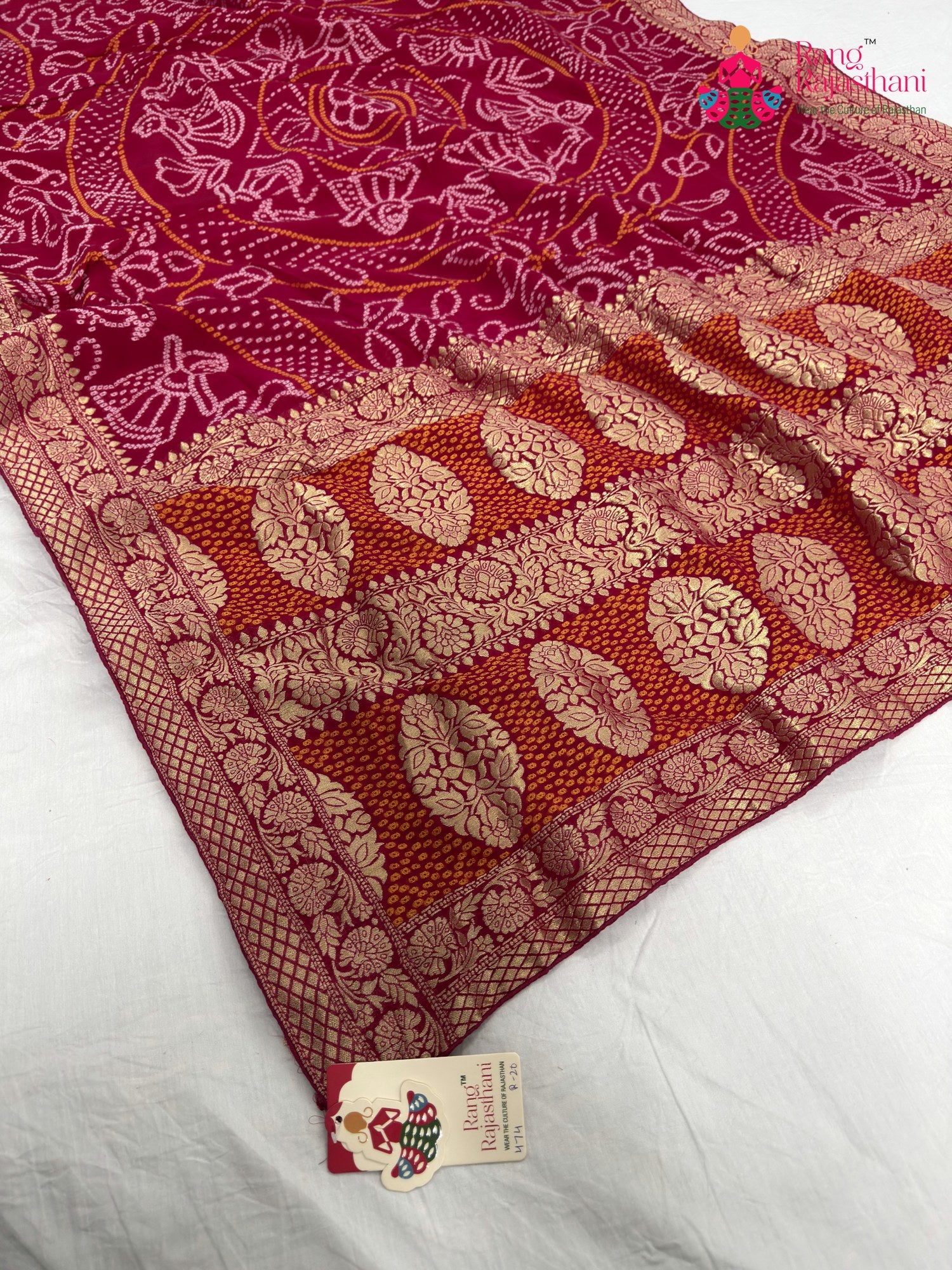 close up detailing of rani soft georgette bandhani saree