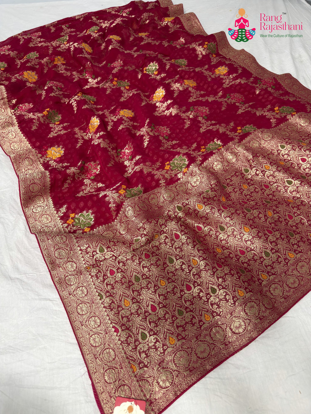 close up detailing of rani soft georgette meenakari zari saree