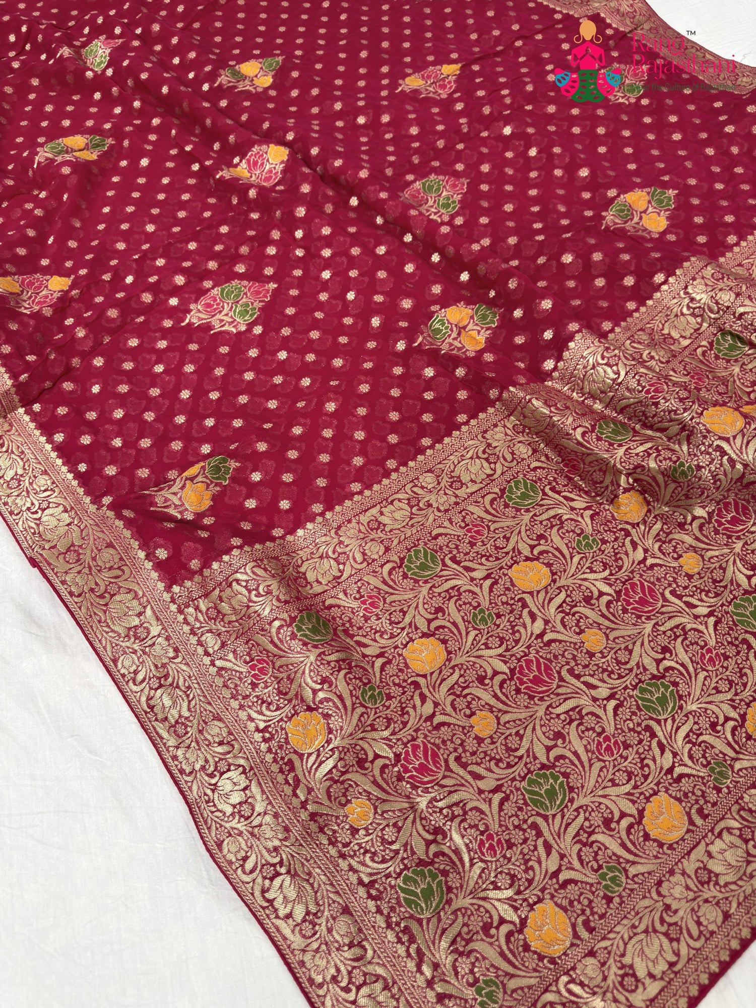 close up detailing of rani soft georgette meenakari zari saree