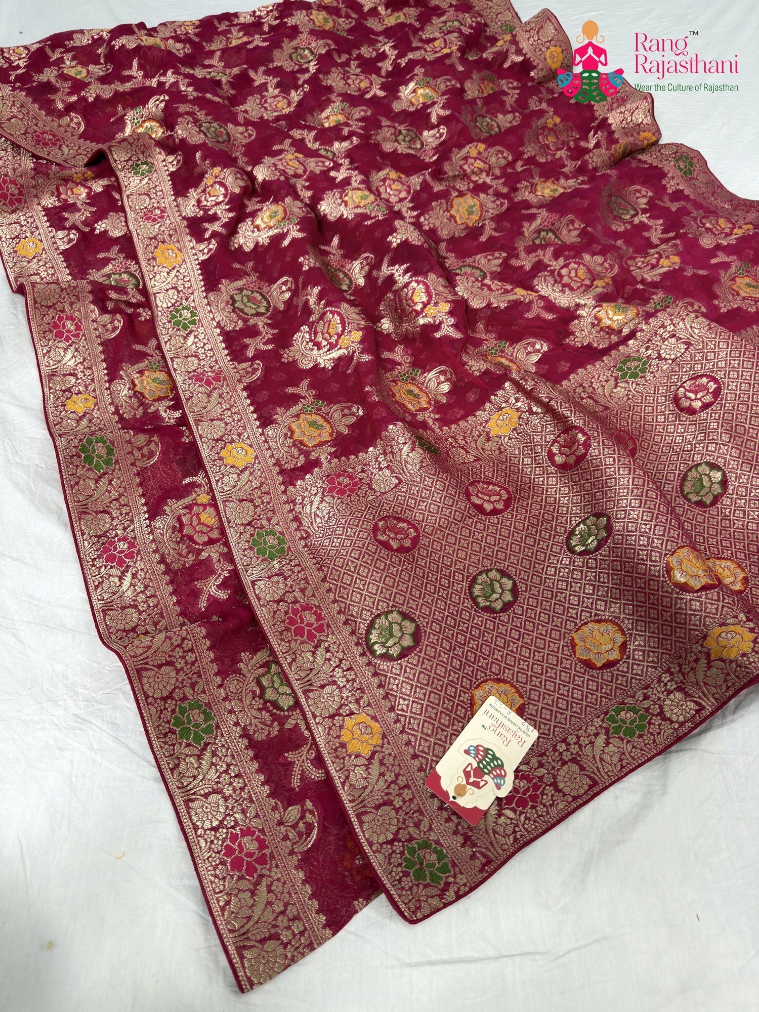 close up detailing of rani soft georgette meenakari zari saree