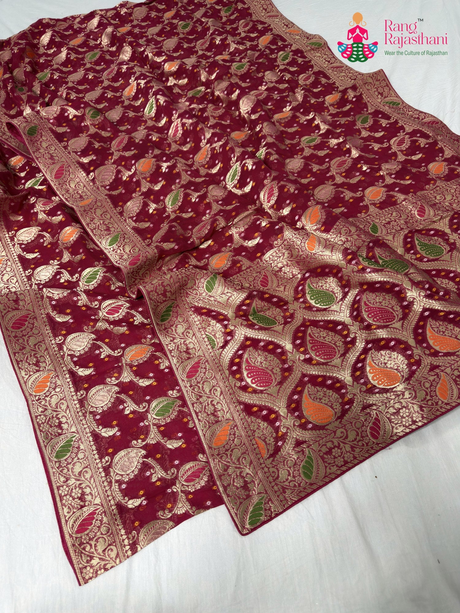 close up detailing of rani soft georgette meenakari zari saree