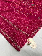 border detailing of rani synthetic bandhani saree