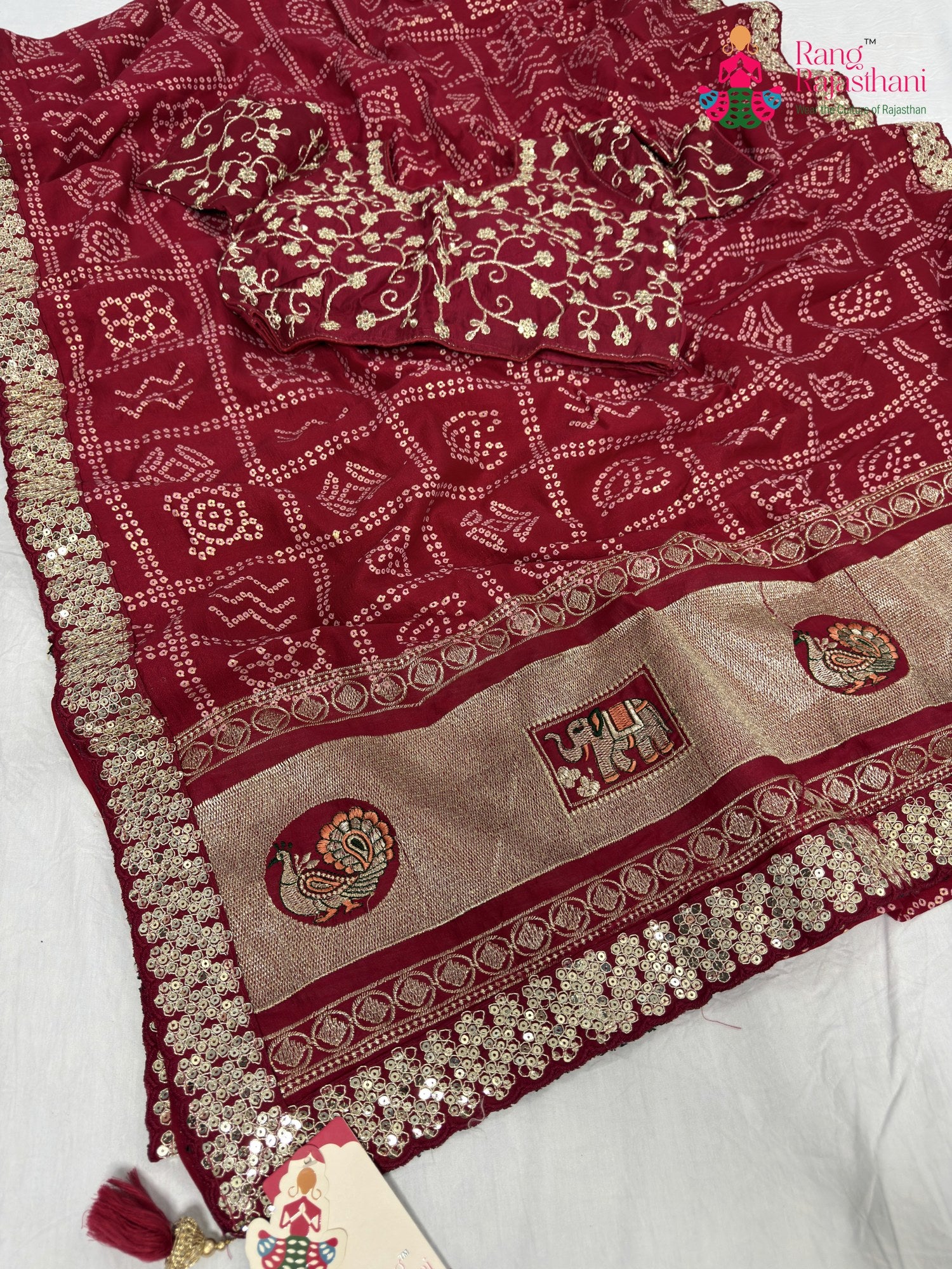 close up detailing of rani synthetic zari embroidery saree