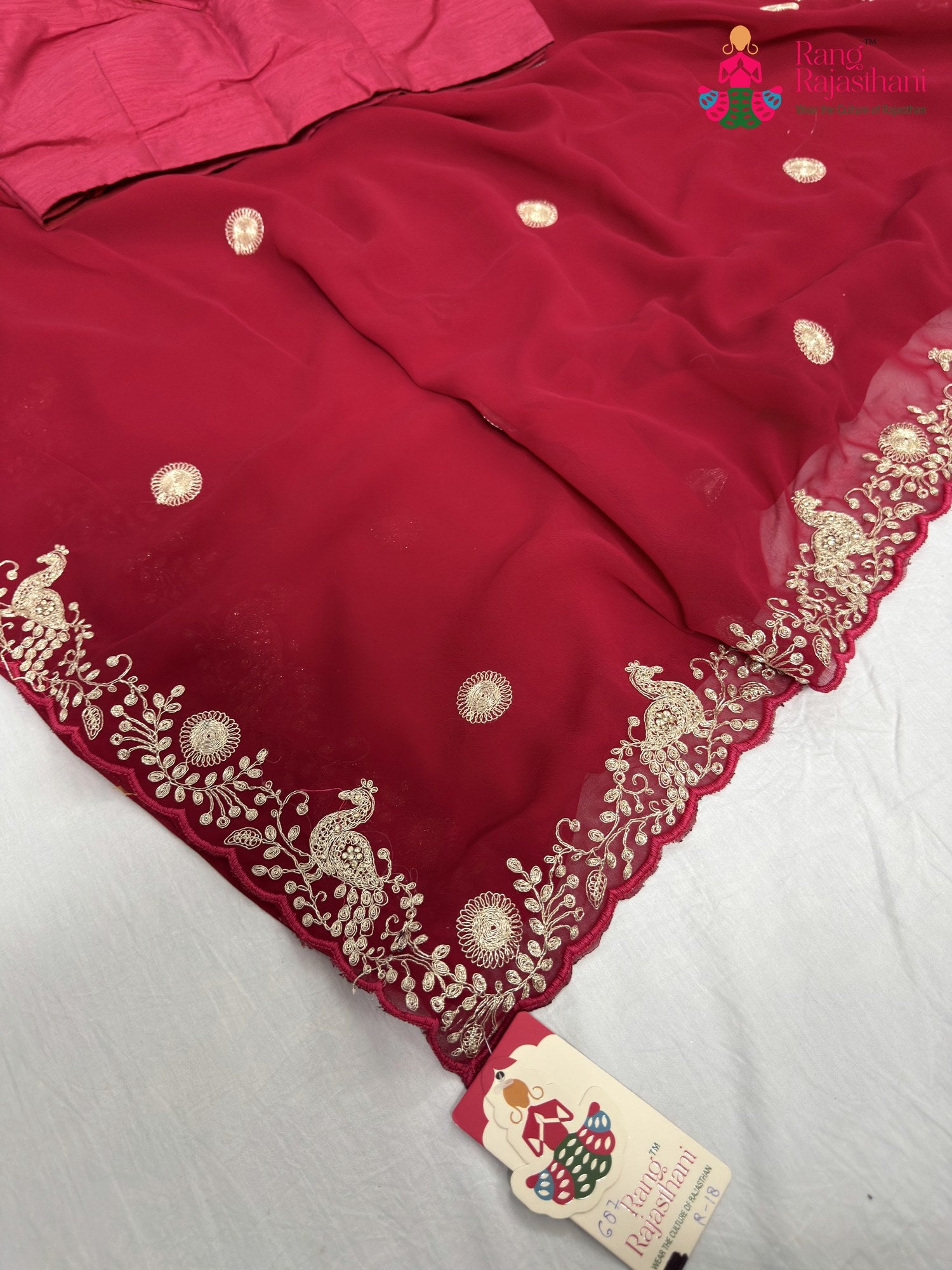 close up detailing of rani synthetic zari embroidery saree