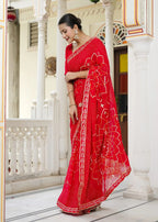 Red Synthetic Georgette saree with Gota Patti Work and Chundi back view