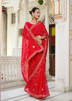 Red Synthetic Georgette saree with Gota Patti Work and Chundi close up detailing