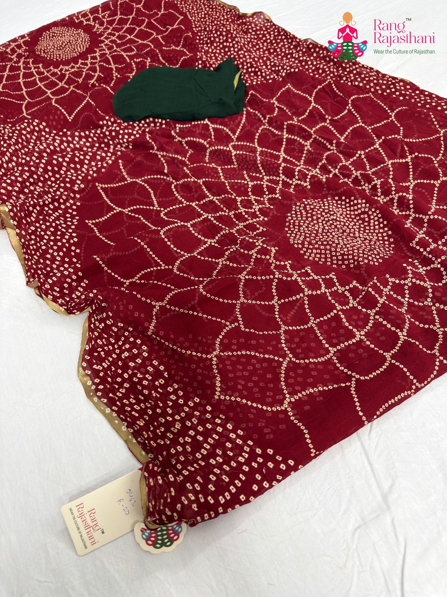 pallu detailing of red chiffon bandhani saree