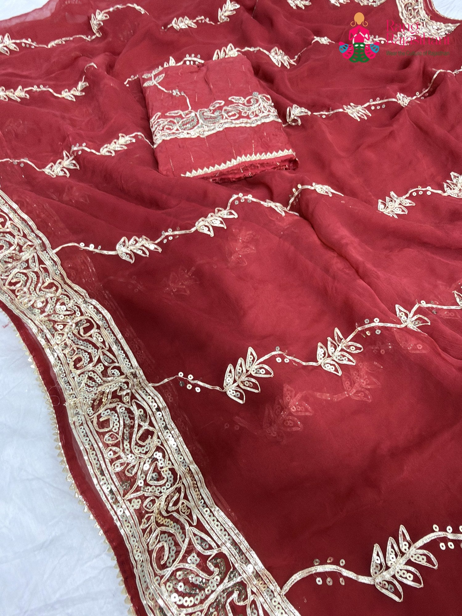 close up detailing of red chiffon gota patti saree