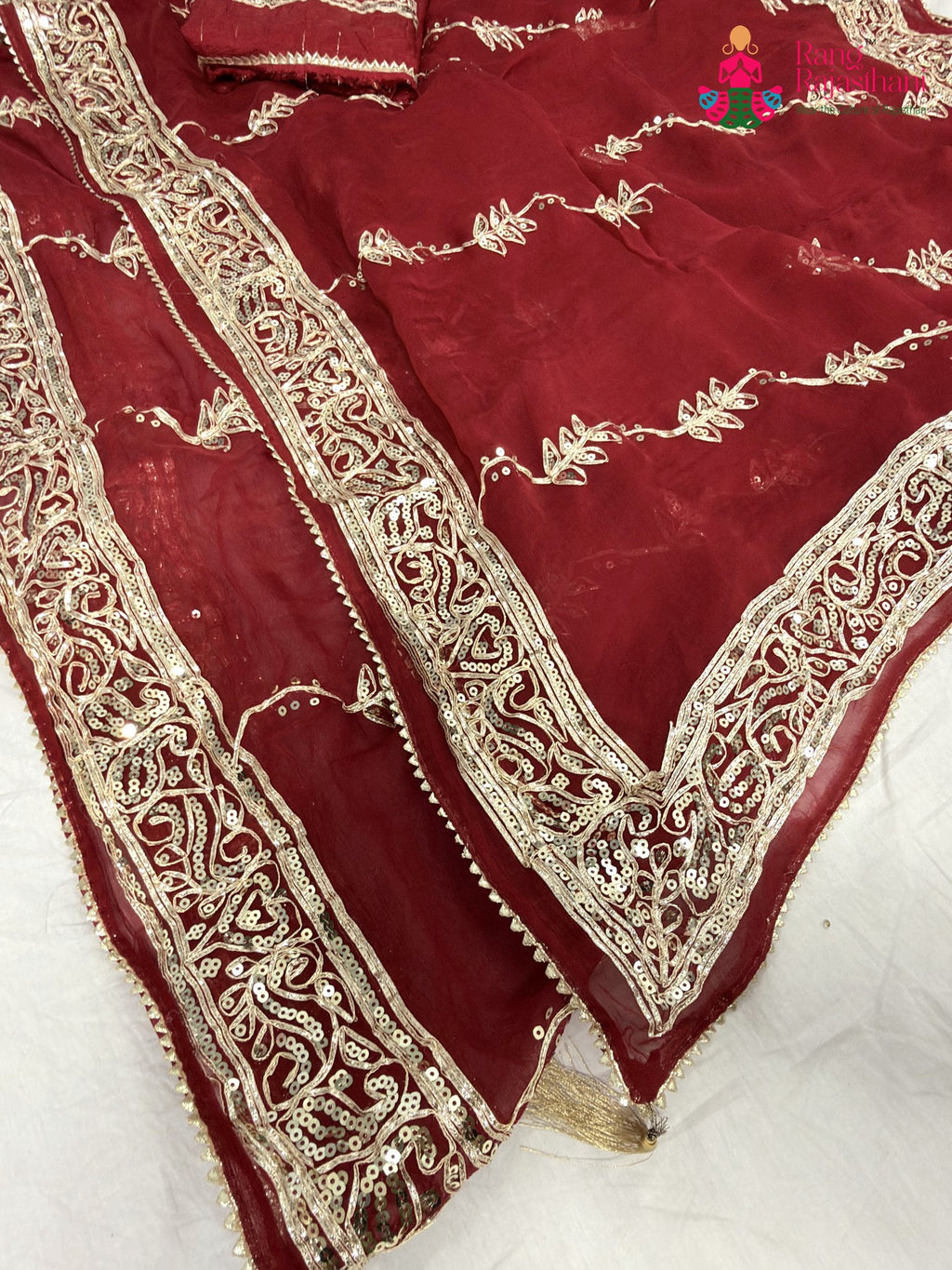border detailing of red chiffon gota patti saree