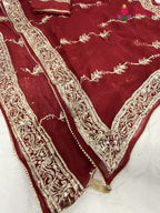 border detailing of red chiffon gota patti saree