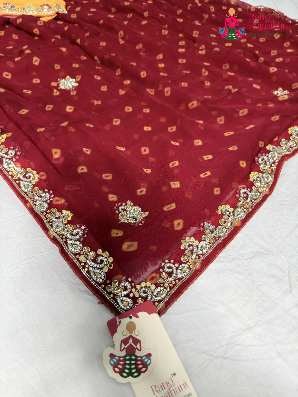 pallu detailing of red chiffon hand embellishment saree