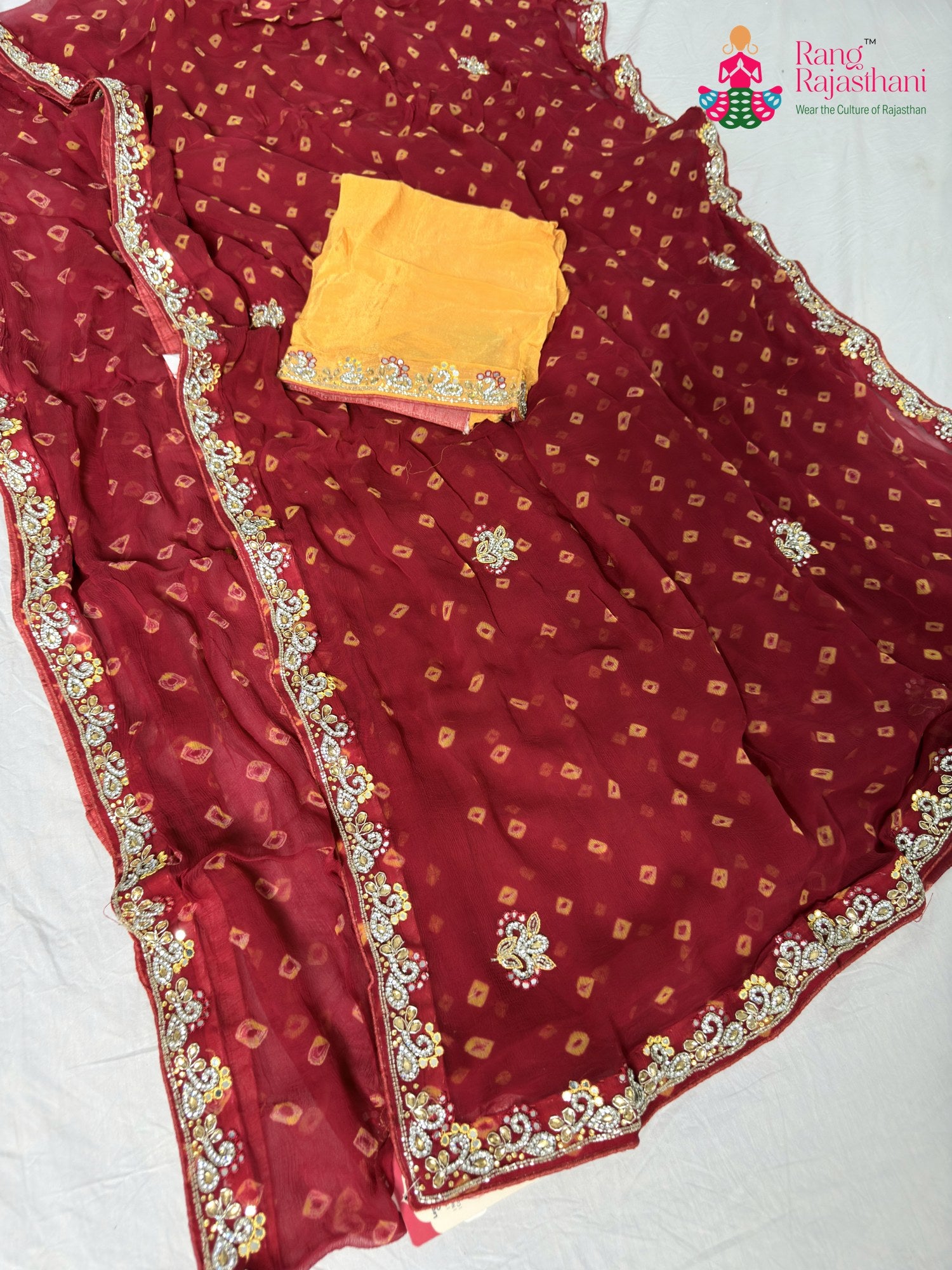 border detailing of red chiffon hand embellishment saree