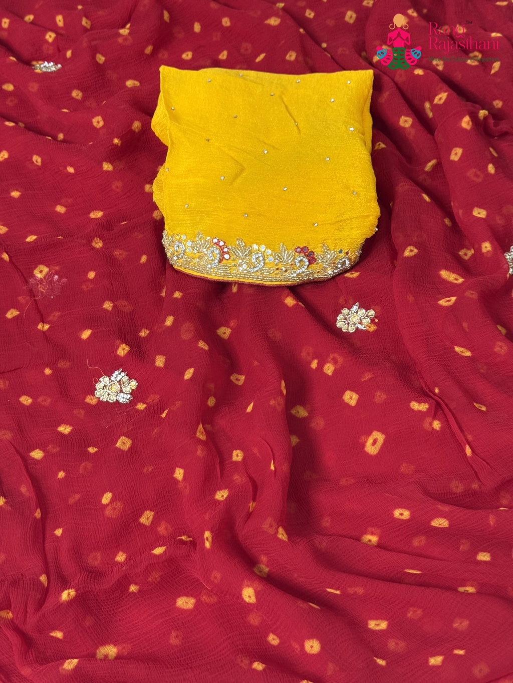 pallu detailing of red chiffon hand embellishment saree
