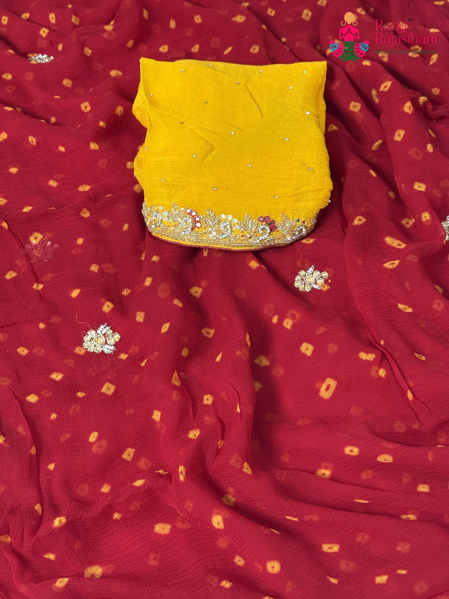pallu detailing of red chiffon hand embellishment saree