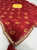 pallu detailing of red chiffon hand embellishment saree
