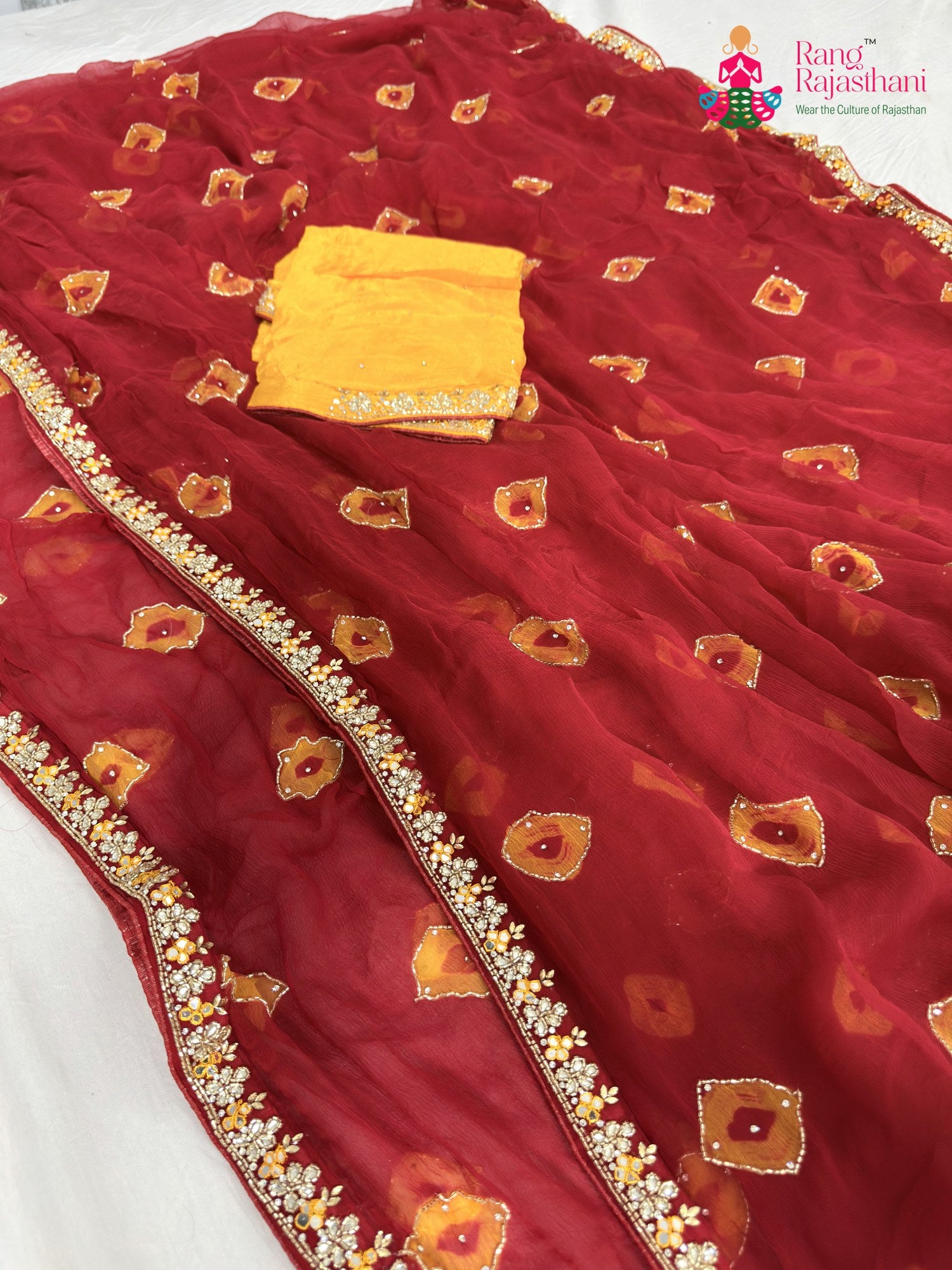 border detailing of red chiffon hand embellishment saree