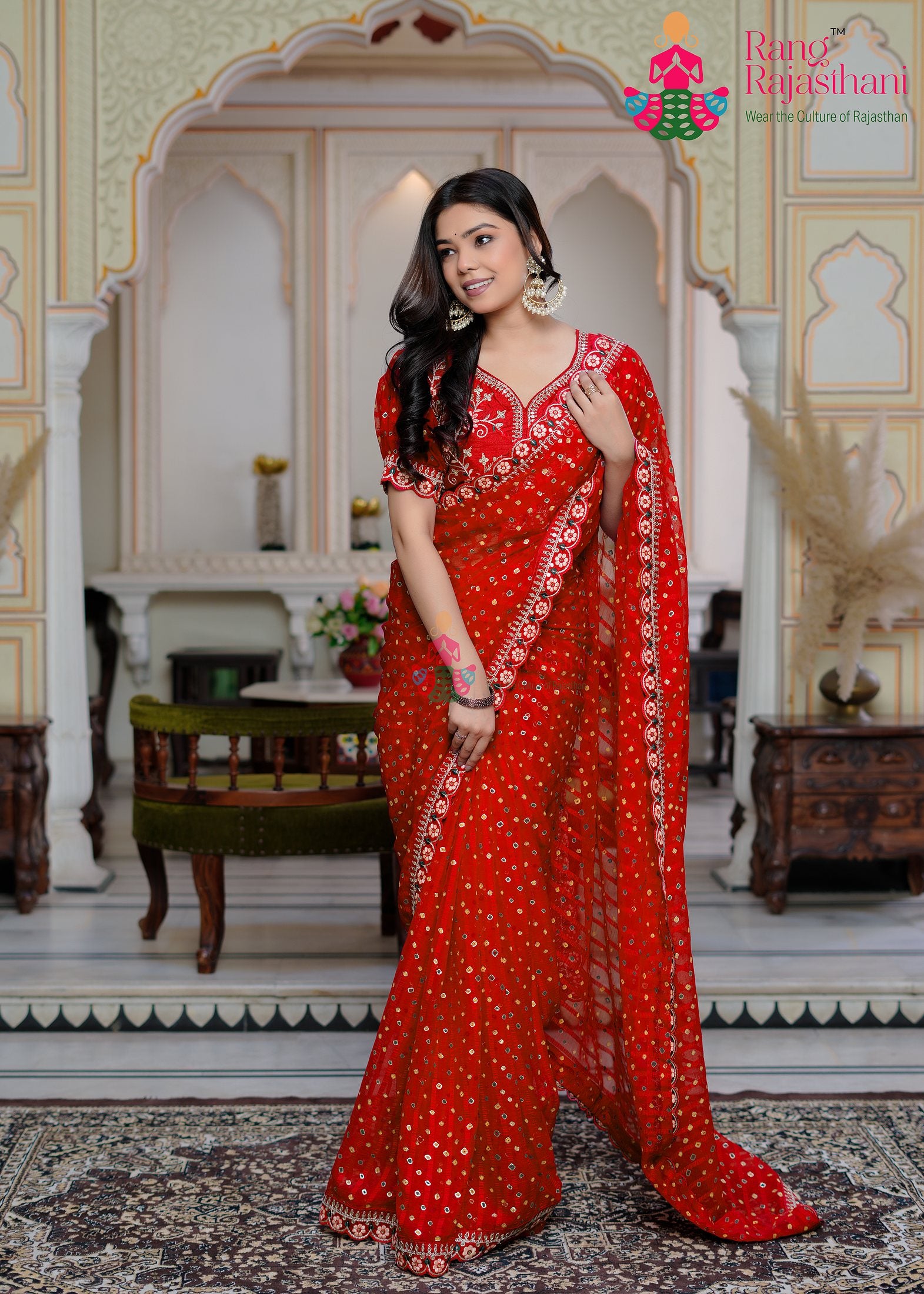 close up detailing of red chiffon saree 