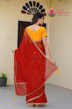 close up detailing of red chiffon saree 