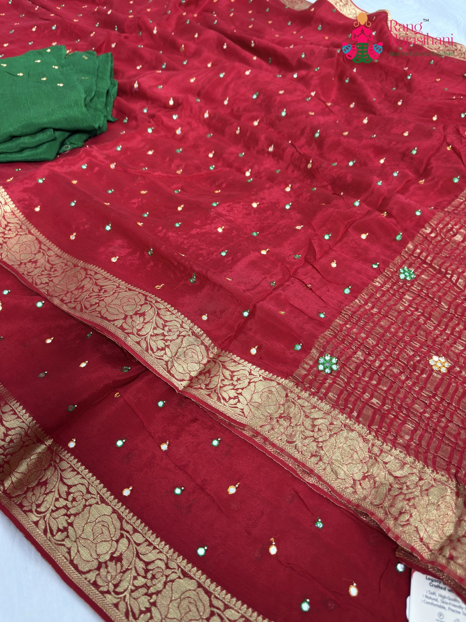 border detailing of red chinnon banarasi zari weave saree