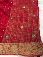 pallu detailing of red chinnon banarasi zari weave saree