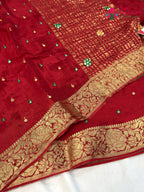 close up view of red chinnon banarasi zari weave saree