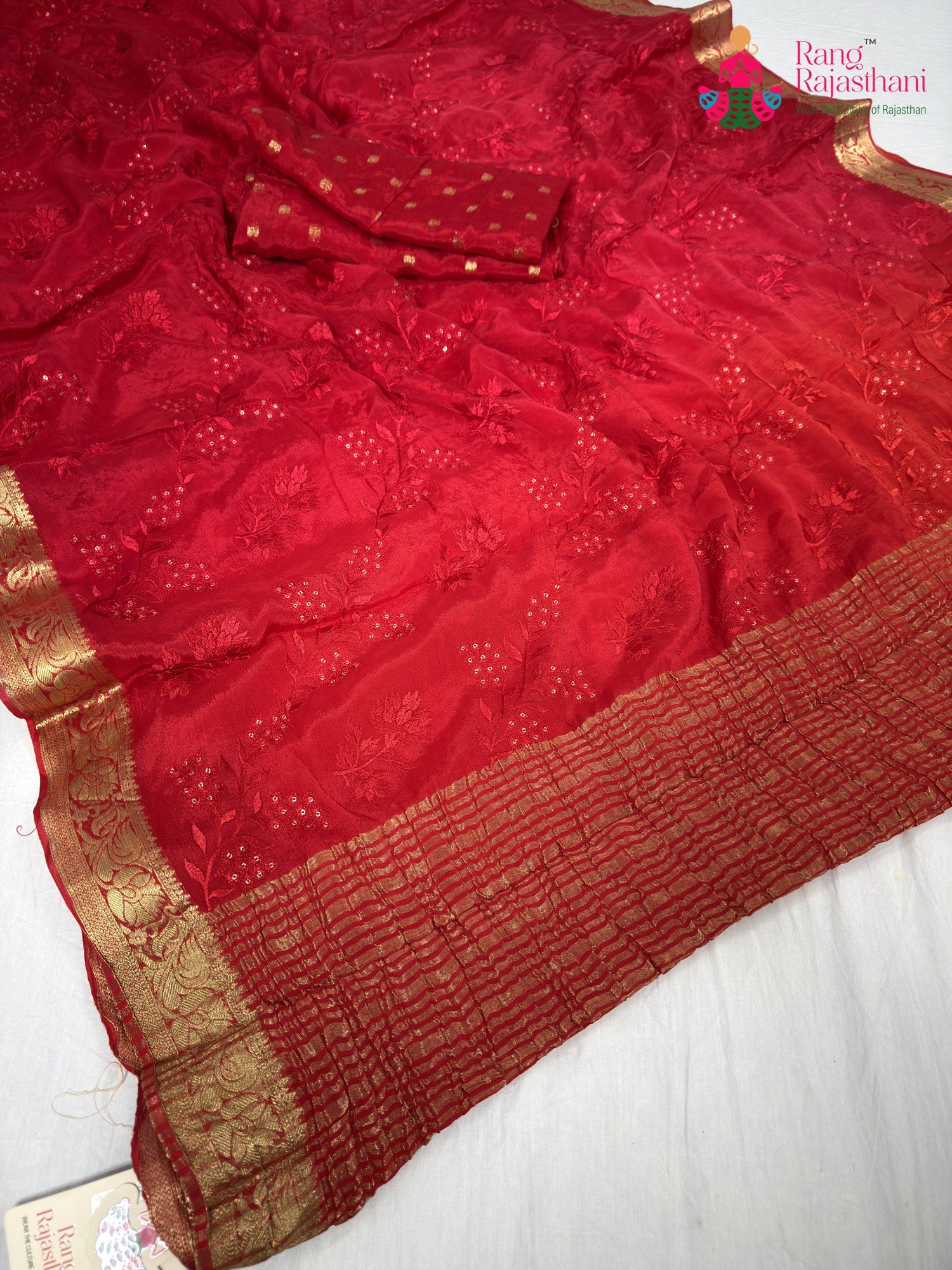 pallu detailing of red chinnon resham embroidery saree