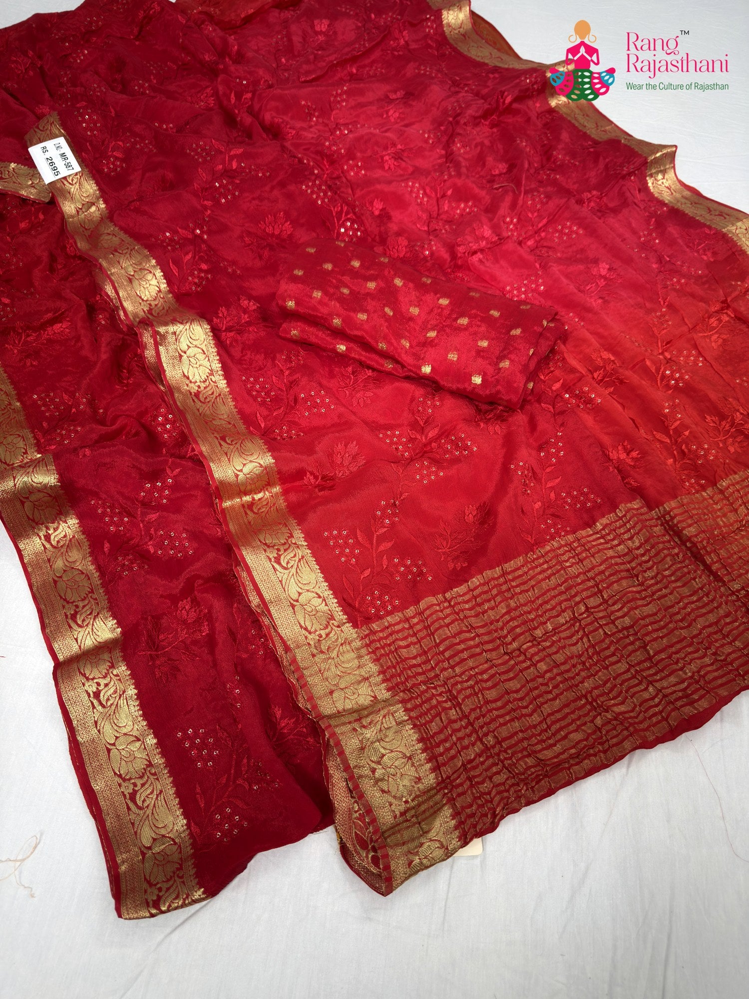 close up detailing of red chinnon resham embroidery saree