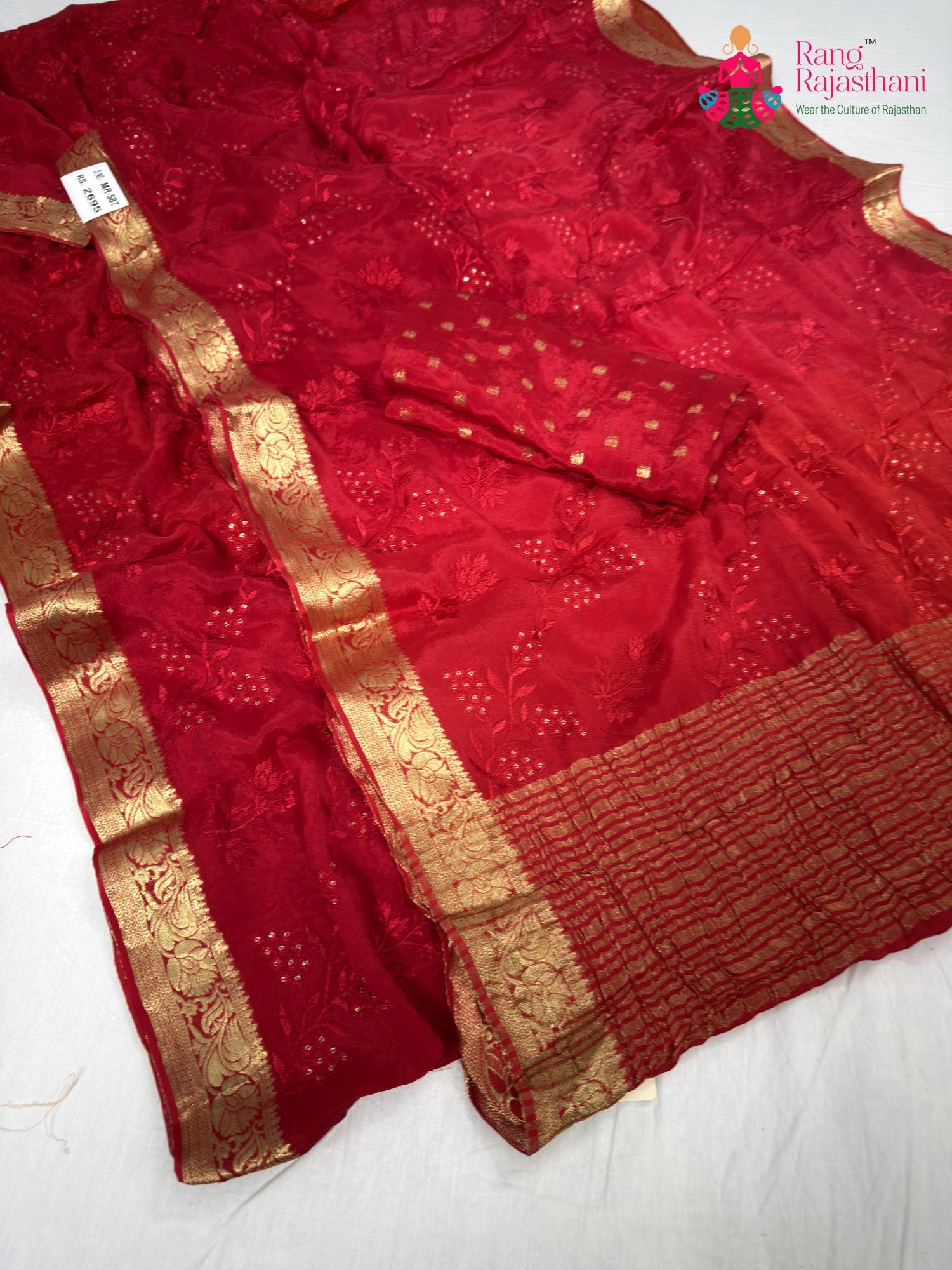 border detailing of red chinnon resham embroidery saree