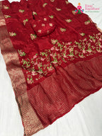 pallu detailing of red chinnon resham embroidery saree