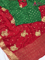border detailing of red chinnon saree