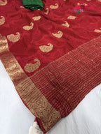 pallu detailing of red chinnon zari embroidery saree