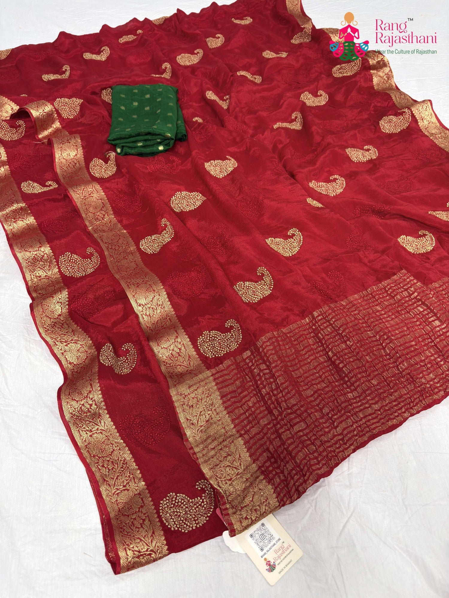 close up detailing of red chinnon zari embroidery saree