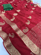 border detailing of red chinnon zari embroidery saree