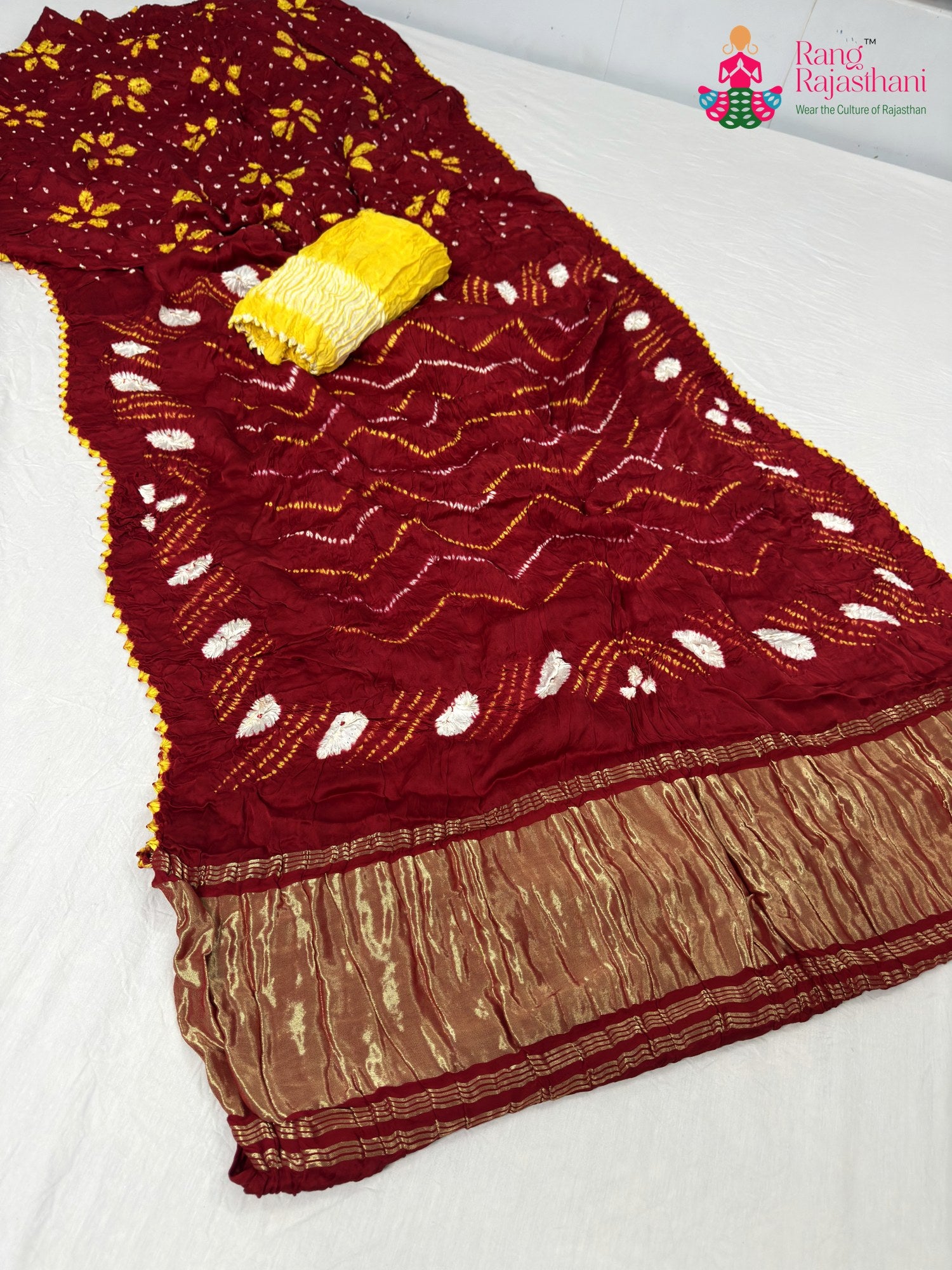 pallu detailing of red gajji silk bandhani saree