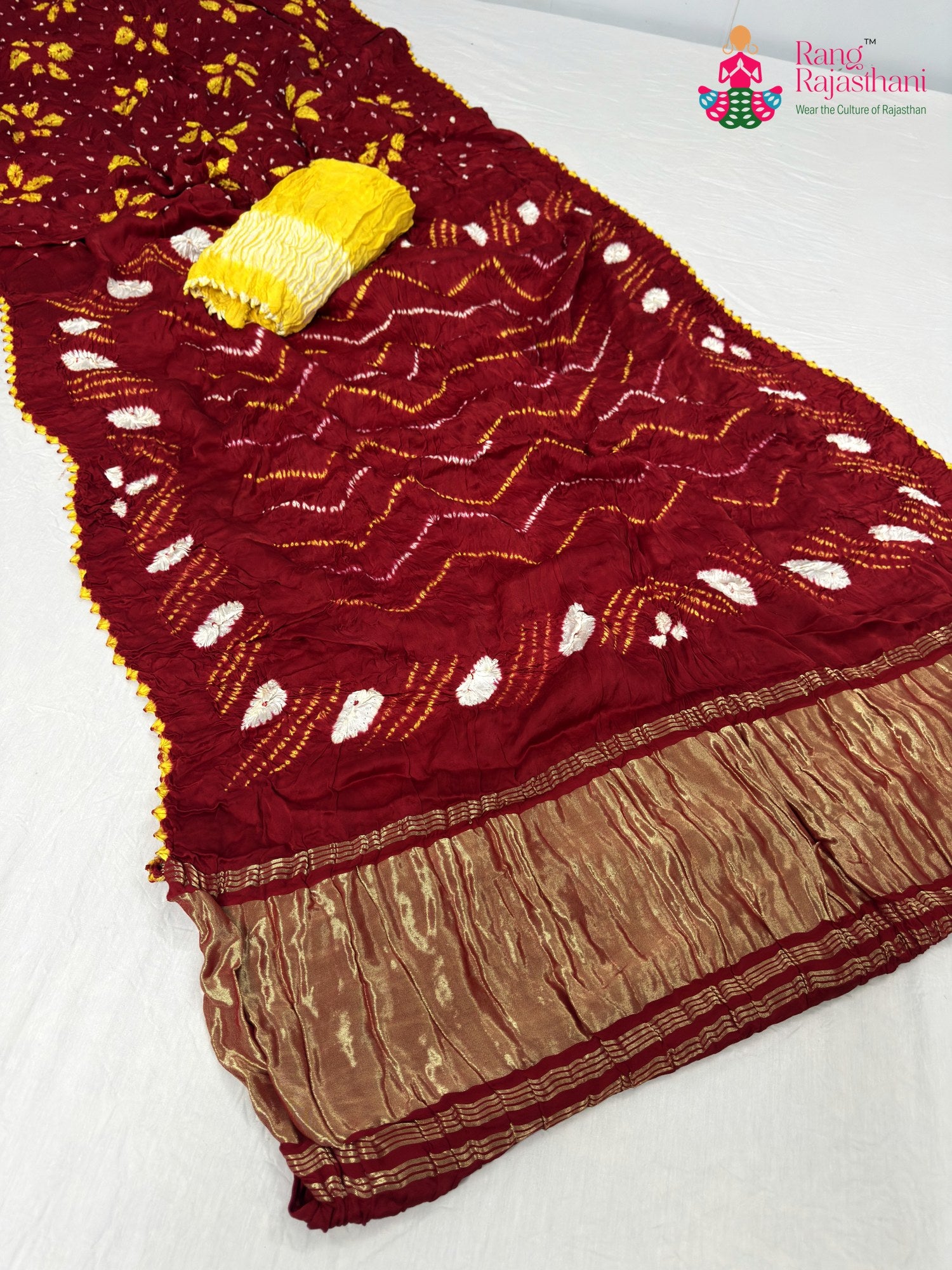 close up detailing of red gajji silk bandhani saree