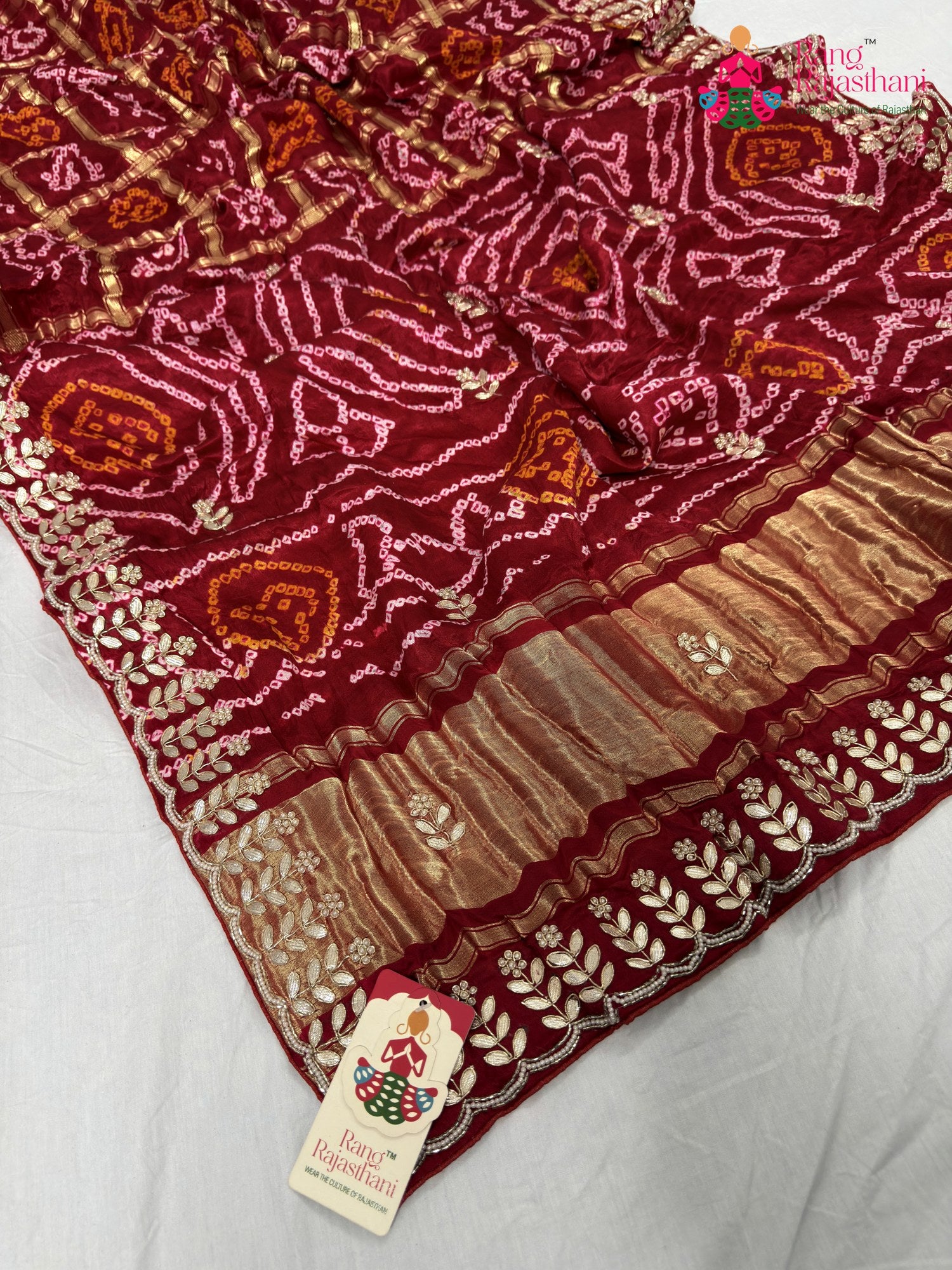close up detailing of red gajji silk bandhani saree