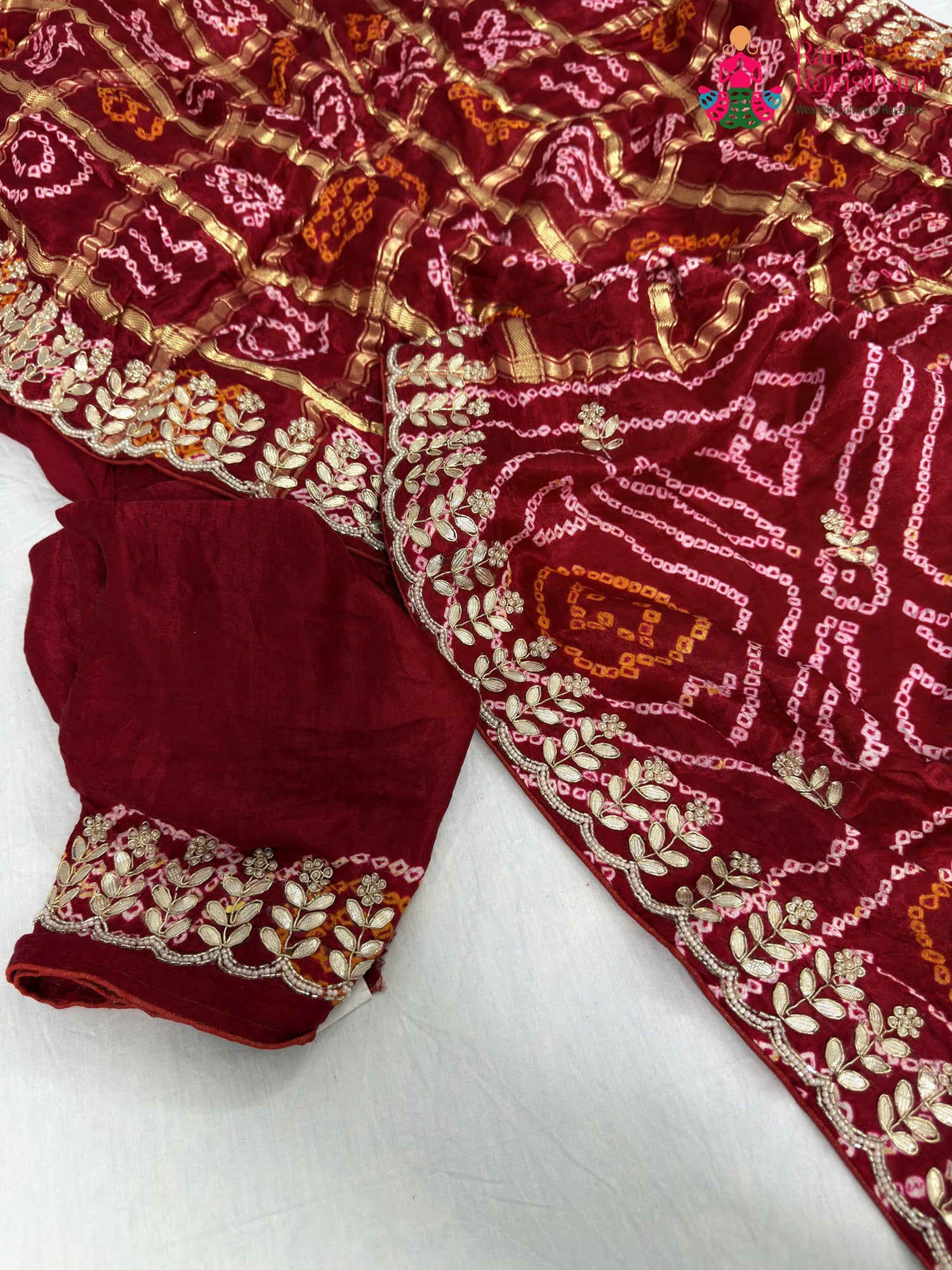 border detailing of red gajji silk bandhani saree